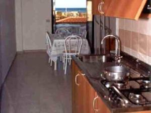 Kuchyň nebo kuchyňský kout v ubytování Aquamarine Residence