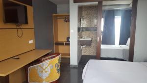 Postel nebo postele na pokoji v ubytování Fini Hotel Bobende