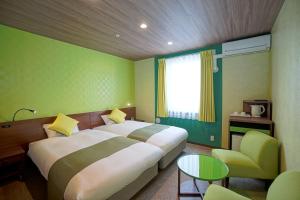 Postel nebo postele na pokoji v ubytování La'gent Hotel Tokyo Bay