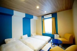 Postel nebo postele na pokoji v ubytování La'gent Hotel Tokyo Bay
