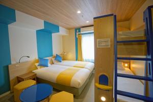 Postel nebo postele na pokoji v ubytování La'gent Hotel Tokyo Bay