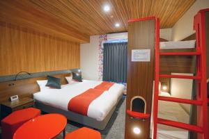 Postel nebo postele na pokoji v ubytování La'gent Hotel Tokyo Bay
