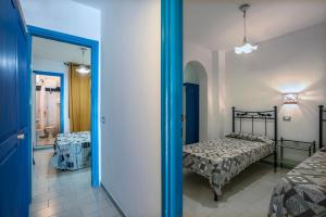 เตียงในห้องที่ Magi - Appartamenti Maga Circe