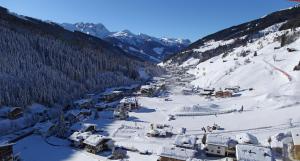 a view of a ski resort in the snow at Hotel Maria Theresia in Gerlos