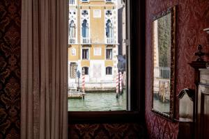 
a painting of a building with a window at Hotel Galleria in Venice
