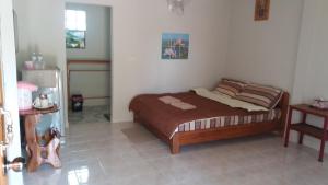 a bedroom with a bed in the corner of a room at Jasmin Resort in Mae Hong Son