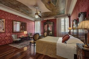 
a bedroom with a large bed and a large window at Hotel Galleria in Venice
