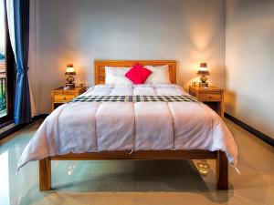 Postel nebo postele na pokoji v ubytování Bali Full Moon Guest House