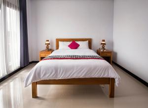Postel nebo postele na pokoji v ubytování Bali Full Moon Guest House