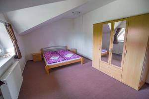 A bed or beds in a room at Apartmán Relax