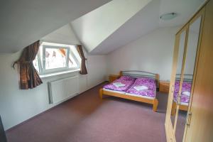 A bed or beds in a room at Apartmán Relax