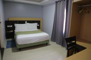 Postel nebo postele na pokoji v ubytování Fini Hotel Bobende