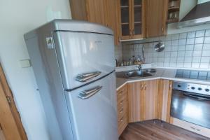 A kitchen or kitchenette at Apartmán Relax Még 5 kép