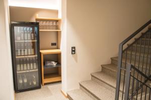 a staircase with a wine cellar next to a stair case at Weinhotel Maitz Wolfgang in Ratsch an der Weinstraße