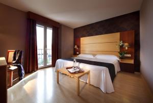 Кровать или кровати в номере Hotel Villa Blanca