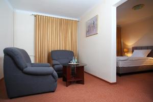 Postel nebo postele na pokoji v ubytování Inter Hotel