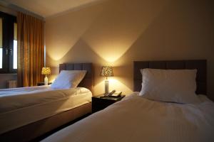Postel nebo postele na pokoji v ubytování Inter Hotel