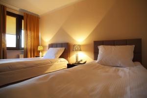 Postel nebo postele na pokoji v ubytování Inter Hotel