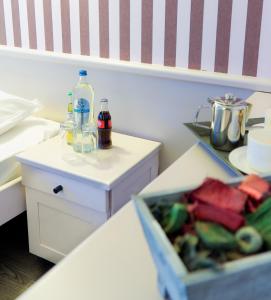 a kitchen with a counter with a box of food at Golf Hotel Mergelhof in Gemmenich