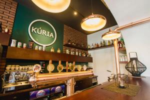 a bar with a kiruna sign on the wall at Penzión Kúria in Nové Mesto nad Váhom