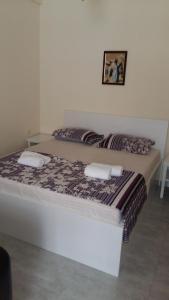 Postel nebo postele na pokoji v ubytování Guest House Kldiashvili