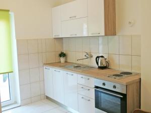 A kitchen or kitchenette at Apartments Jelena