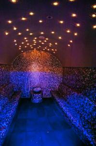 a room with a stage with chairs and lights at Grand Hotel Park in Dubrovnik