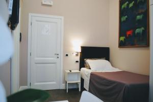 מיטה או מיטות בחדר ב-Guest House Cavour 278