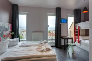 Cama o camas de una habitación en MEININGER Hotel Berlin Alexanderplatz