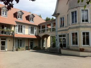 a large building with a lot of windows at Hôtel du Rangen in Thann