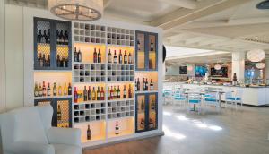 a wine store with a wall of wine bottles at H10 Suites Lanzarote Gardens in Costa Teguise