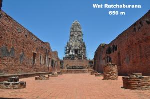 a view of a building with a clock tower in the background at Early Bird Hostel Ayutthaya in Phra Nakhon Si Ayutthaya