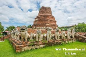 a group of statues in front of a pagoda at Early Bird Hostel Ayutthaya in Phra Nakhon Si Ayutthaya
