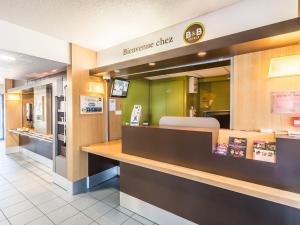 The lobby or reception area at B&B HOTEL Strasbourg Sud Geispolsheim