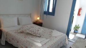 Ліжко або ліжка в номері Artemis Rooms