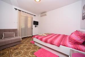 Postel nebo postele na pokoji v ubytování MG apartments and rooms
