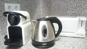 a coffee maker and a toaster on a counter at La Devesa de Gerona in Girona