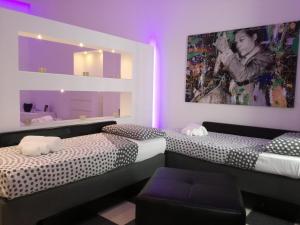 Postel nebo postele na pokoji v ubytování La Bella Trani - Suites and B&B