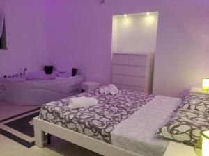 Postel nebo postele na pokoji v ubytování La Bella Trani - Suites and B&B