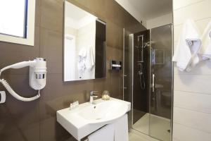 a bathroom with a sink and a shower at Garden Hotel Ripa in Vieste