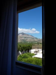 a window with a view of a mountain at Casabettina in Valderice