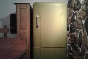 a gold refrigerator sitting next to a wall at Casita de Piedra B&B in Villa del Dique