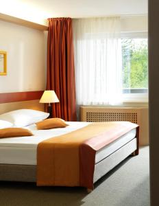 Postel nebo postele na pokoji v ubytování Garni Hotel Savica - Sava Hotels & Resorts