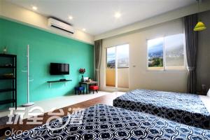Katil atau katil-katil dalam bilik di Outingfun Bed and Breakfast