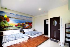 Katil atau katil-katil dalam bilik di Outingfun Bed and Breakfast