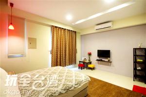 Katil atau katil-katil dalam bilik di Outingfun Bed and Breakfast