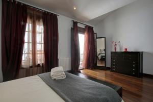 Łóżko lub łóżka w pokoju w obiekcie Holiday House Tenorio