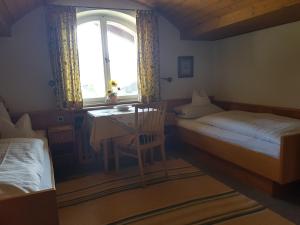 Postel nebo postele na pokoji v ubytování Gästehaus Meran
