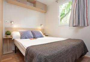 Postel nebo postele na pokoji v ubytování Camping Sènia Riu + 37 fotografií