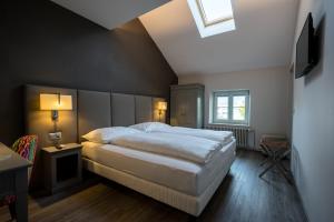 Postel nebo postele na pokoji v ubytování Hôtel du Théâtre, Boutique Hôtel